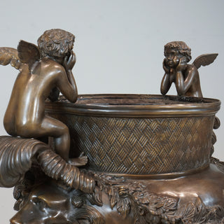 URN WITH CUPIDS SITTING