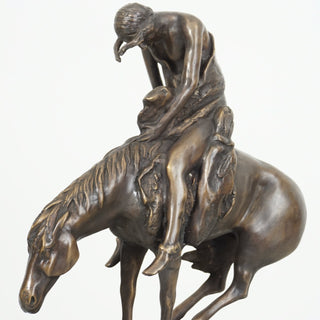 Cowboy on Horse Statue on Marble