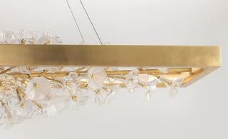 Jasmine 60" Wide LED Suspension Linear Chandelier with Flower Motif Centerpiece